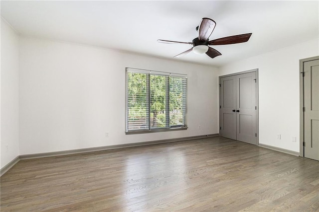 26 Ivy Pkwy NE, Atlanta, GA 30342 - unfurnished bedroom featuring wood finished floors, baseboards, and ceiling fan
