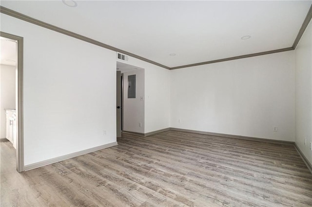26 Ivy Pkwy NE, Atlanta, GA 30342 - spare room featuring ornamental molding, light wood-style floors, and baseboards
