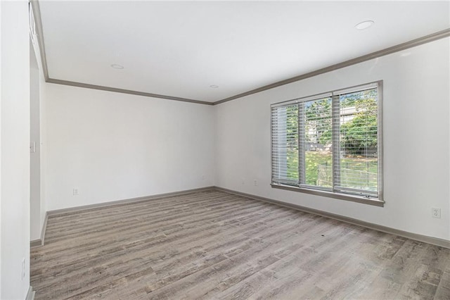 26 Ivy Pkwy NE, Atlanta, GA 30342 - spare room featuring crown molding, wood finished floors, and baseboards