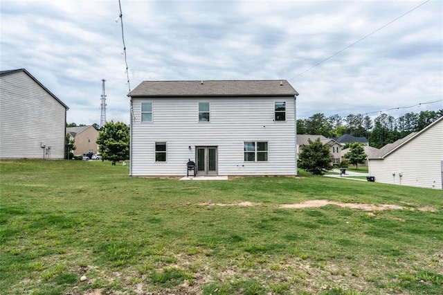 8553 Braylen Manor Dr, Douglasville, GA 30134 - rear view of property featuring a lawn, a patio, and french doors