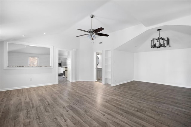 unfurnished living room with built in shelves, baseboards, lofted ceiling, ceiling fan with notable chandelier, and wood finished floors