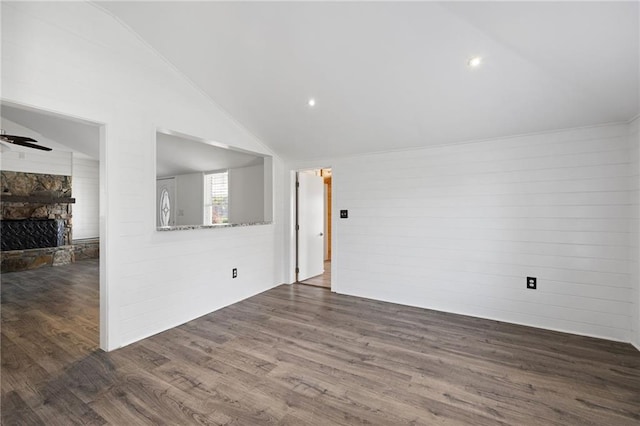 unfurnished living room with a fireplace, a ceiling fan, lofted ceiling, and dark wood-style flooring