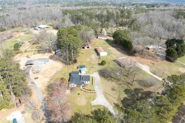 bird's eye view featuring a rural view and a wooded view