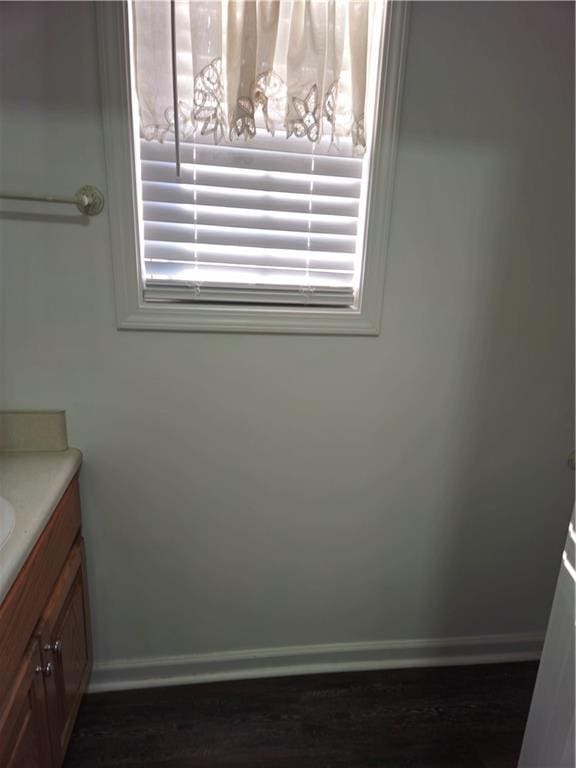 bathroom featuring baseboards and vanity