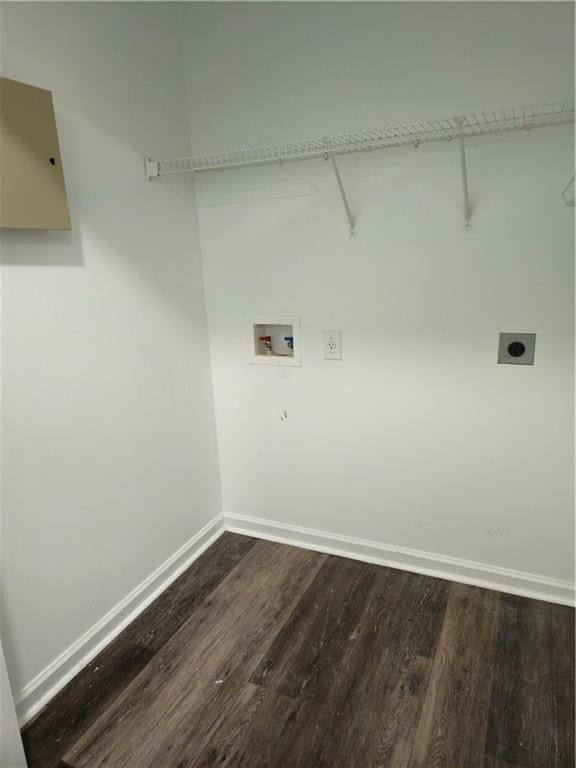 washroom with electric dryer hookup, baseboards, dark wood-style flooring, and laundry area