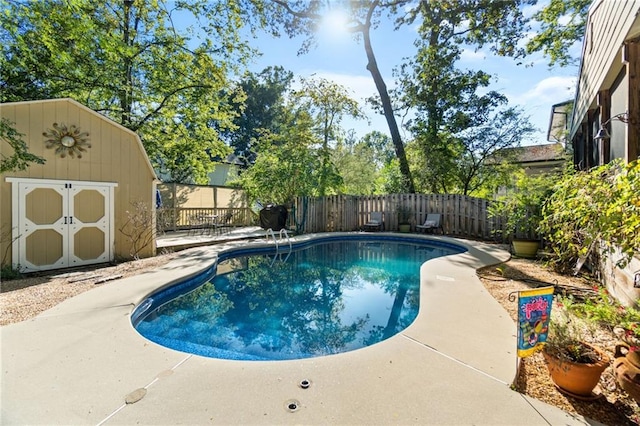 view of swimming pool featuring a storage unit and a patio area