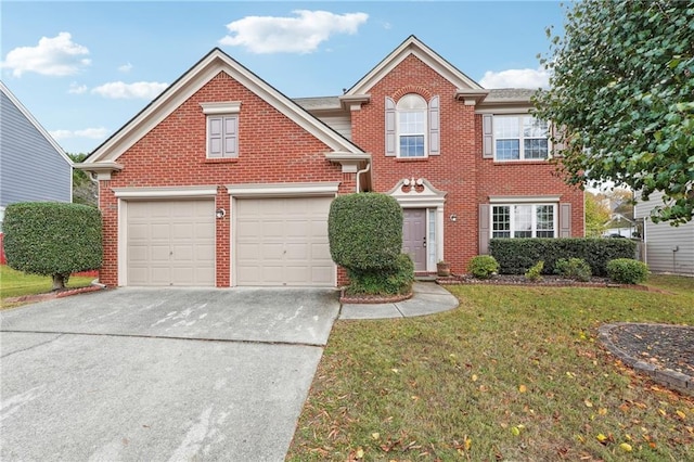 view of front of home with a garage and a front lawn