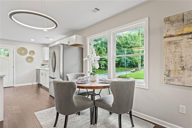 dining area with baseboards, visible vents, dark wood finished floors, and recessed lighting