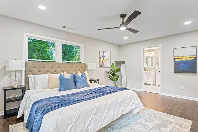 bedroom featuring dark wood-style floors, baseboards, and recessed lighting