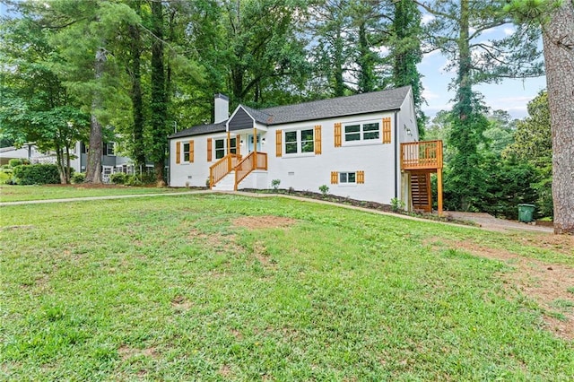 ranch-style home with stairs, a front lawn, a chimney, and a wooden deck