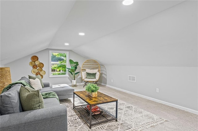 carpeted living room featuring lofted ceiling, visible vents, baseboards, and recessed lighting