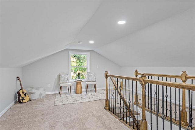 additional living space with carpet floors, recessed lighting, vaulted ceiling, and baseboards