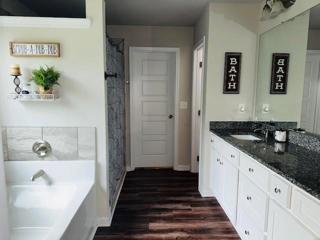 50 Scout Hut Rd, Danielsville, GA 30633 - bathroom featuring vanity, a garden tub, wood finished floors, baseboards, and a shower with curtain