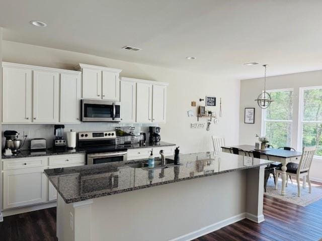50 Scout Hut Rd, Danielsville, GA 30633 - kitchen featuring appliances with stainless steel finishes, dark wood finished floors, a sink, tasteful backsplash, and recessed lighting