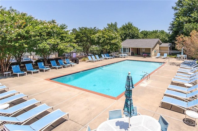 view of swimming pool featuring a patio area