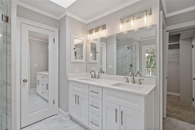 bathroom featuring vanity, a shower with shower door, and crown molding