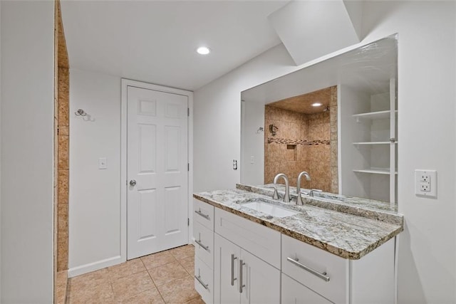 bathroom with tile patterned flooring and vanity