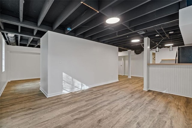 basement featuring hardwood / wood-style floors