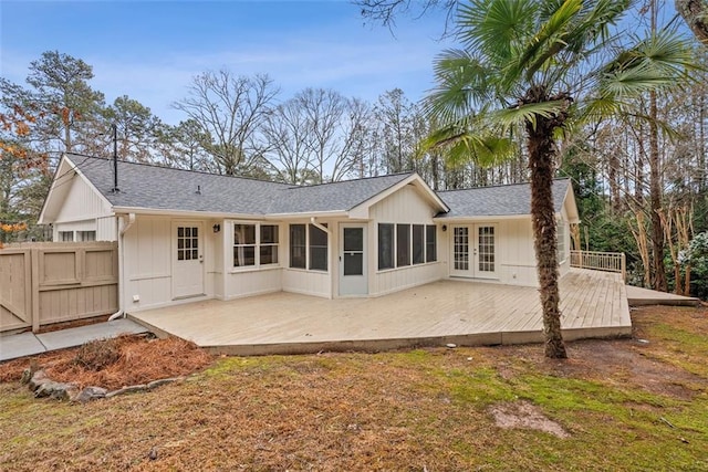 back of property featuring french doors and a sunroom