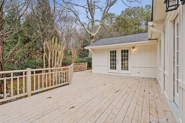 wooden deck featuring french doors