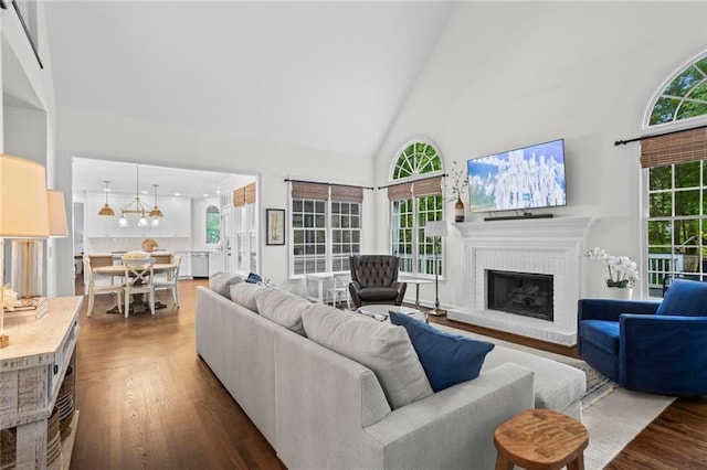 605 Linkside Holw, Alpharetta, GA 30005 - living area featuring high vaulted ceiling, dark wood finished floors, and a brick fireplace