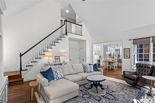 605 Linkside Holw, Alpharetta, GA 30005 - living area with high vaulted ceiling, stairs, dark wood-style floors, and a chandelier