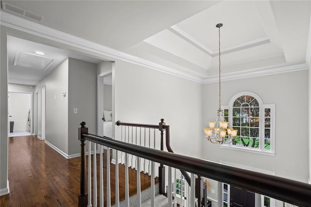 605 Linkside Holw, Alpharetta, GA 30005 - hall featuring attic access, a chandelier, wood finished floors, an upstairs landing, and a tray ceiling