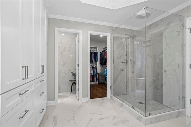 605 Linkside Holw, Alpharetta, GA 30005 - bathroom with marble look tiles, a marble finish shower, crown molding, and a walk in closet
