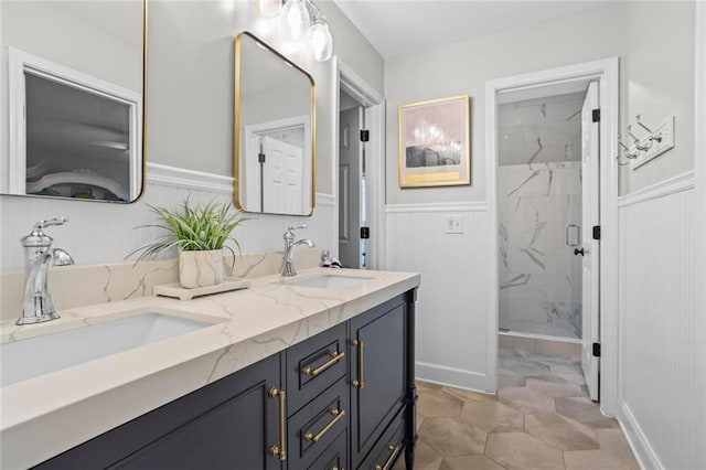 605 Linkside Holw, Alpharetta, GA 30005 - full bath with a marble finish shower, double vanity, wainscoting, and a decorative wall