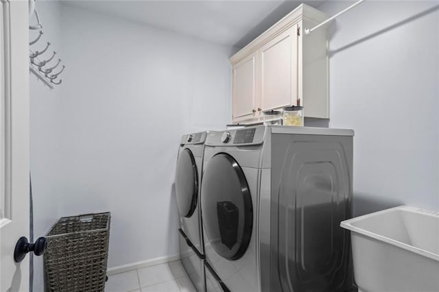605 Linkside Holw, Alpharetta, GA 30005 - washroom featuring independent washer and dryer, cabinet space, and light tile patterned floors