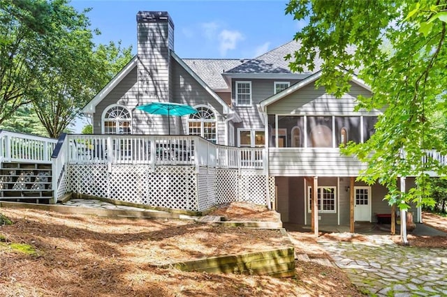 605 Linkside Holw, Alpharetta, GA 30005 - rear view of house featuring a sunroom, stairs, a deck, a chimney, and a patio