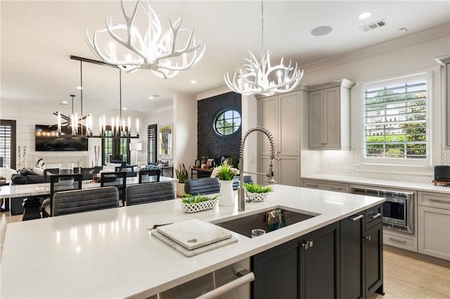 132 Grand Cres, Alpharetta, GA 30009 - kitchen with a chandelier, stainless steel appliances, open floor plan, hanging light fixtures, and recessed lighting
