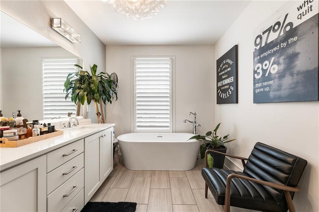 132 Grand Cres, Alpharetta, GA 30009 - full bathroom with a freestanding tub, vanity, and plenty of natural light