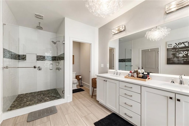 132 Grand Cres, Alpharetta, GA 30009 - full bathroom featuring a chandelier, a shower stall, and double vanity