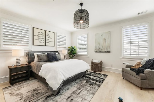 132 Grand Cres, Alpharetta, GA 30009 - bedroom featuring wood finished floors and multiple windows