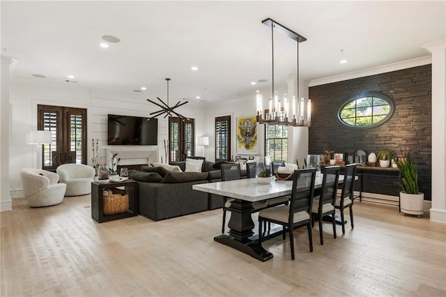 132 Grand Cres, Alpharetta, GA 30009 - dining space featuring a chandelier, a fireplace, light wood-style flooring, and recessed lighting