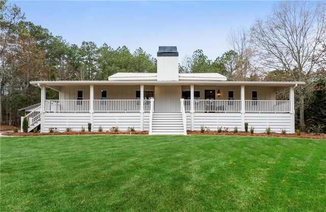 view of front facade featuring board and batten siding, a porch, and a front lawn