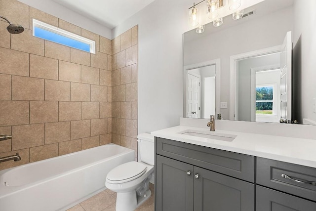 bathroom featuring visible vents, toilet, tile patterned floors, tub / shower combination, and vanity