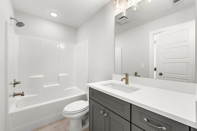 full bathroom with visible vents, vanity, shower / tub combination, and toilet