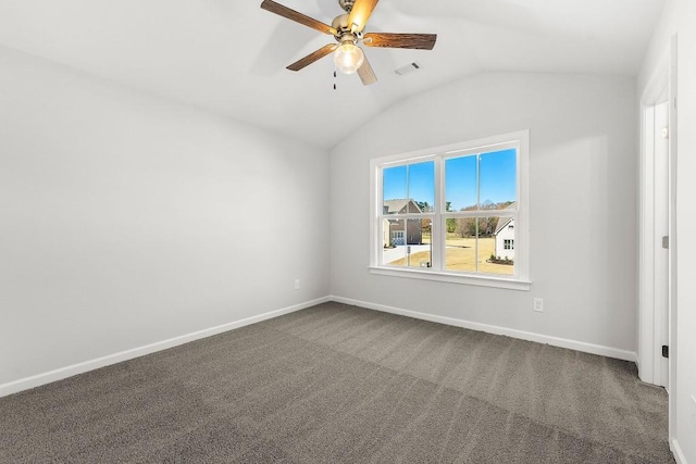 empty room featuring baseboards, visible vents, lofted ceiling, ceiling fan, and carpet flooring