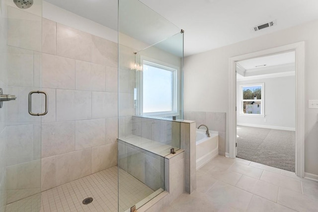 full bathroom with visible vents, baseboards, a garden tub, tile patterned flooring, and a shower stall