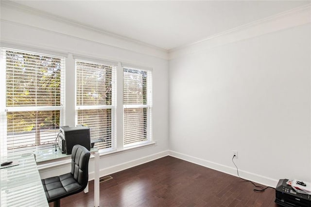 office area with ornamental molding, dark hardwood / wood-style floors, and a healthy amount of sunlight