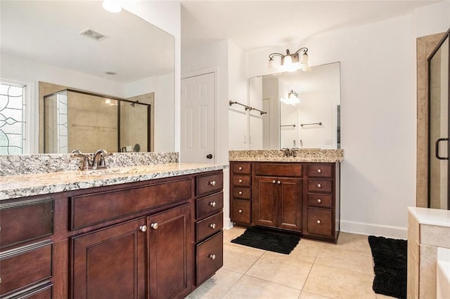 bathroom featuring vanity, tile patterned floors, and an enclosed shower