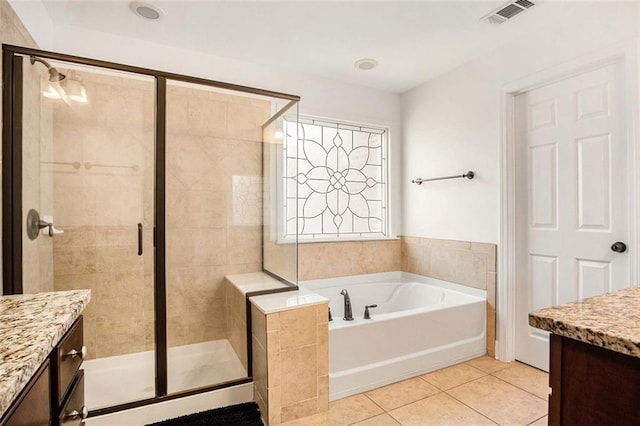 bathroom with separate shower and tub, tile patterned flooring, and vanity