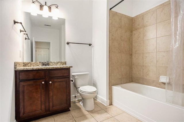 full bathroom featuring tile patterned flooring, vanity, tiled shower / bath combo, and toilet