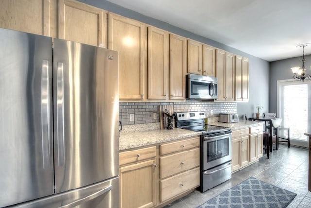 kitchen featuring pendant lighting, a chandelier, backsplash, stainless steel appliances, and light brown cabinets