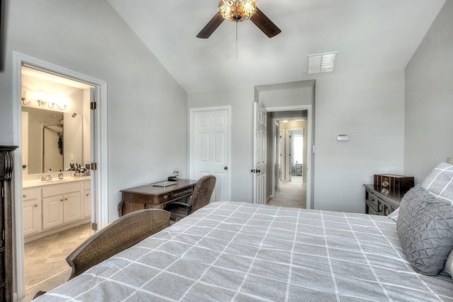 bedroom featuring vaulted ceiling, sink, ensuite bathroom, and ceiling fan