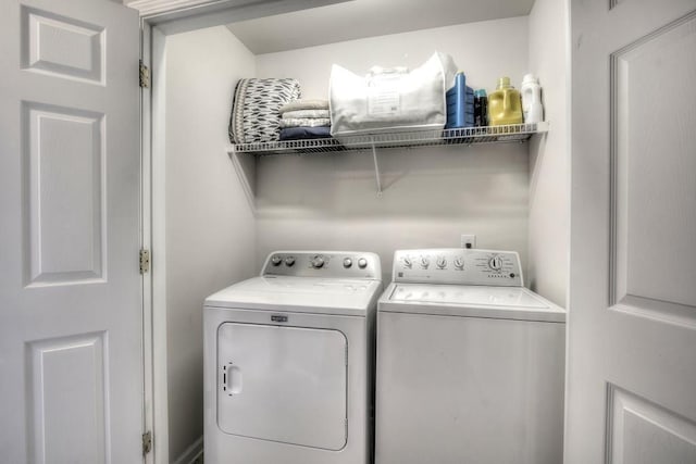 laundry room featuring washer and dryer and laundry area