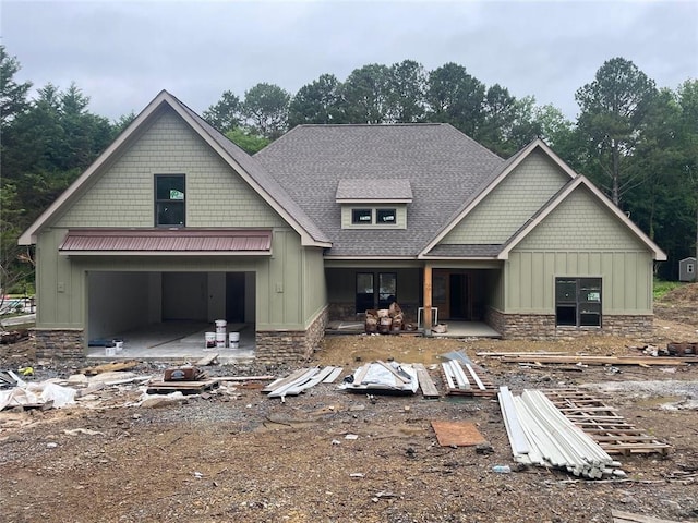 130 Cambridge Ct, Calhoun, GA 30701 - view of front of home with board and batten siding, a patio area, roof with shingles, and stone siding