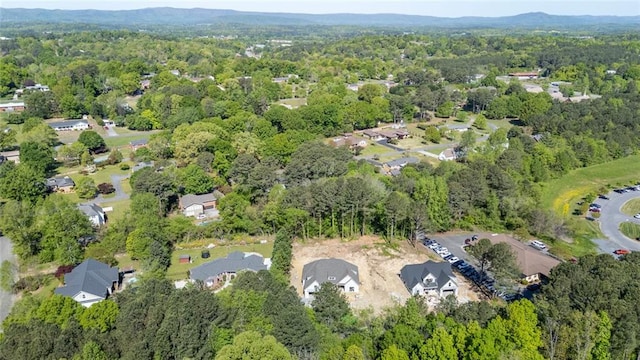 130 Cambridge Ct, Calhoun, GA 30701 - aerial view of property and surrounding area featuring a forest and nearby suburban area